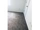 A view of a bedroom featuring neutral carpeting, a white wall and a door at 1188 To Lani Path, Stone Mountain, GA 30083