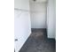 A closet with white walls, gray carpeting, white trim and shelves at 1188 To Lani Path, Stone Mountain, GA 30083