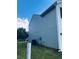 Side view of a well maintained two-story home with vinyl siding and a grassy lawn at 1188 To Lani Path, Stone Mountain, GA 30083