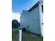 Side view of a well maintained two-story home with vinyl siding and a grassy lawn at 1188 To Lani Path, Stone Mountain, GA 30083