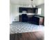 Bright kitchen with modern appliances, beautiful herringbone floors, and sleek dark cabinets at 1188 To Lani Path, Stone Mountain, GA 30083