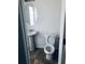 Powder room features a pedestal sink, oval mirror, and a standard white toilet at 1188 To Lani Path, Stone Mountain, GA 30083
