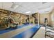 The basement area includes a treadmill, weight-lifting machine, and spiral staircase at 2825 Northeast Ne Expy # F003, Atlanta, GA 30345