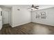 Bedroom with wood-look floors, bright window, and a ceiling fan at 2825 Northeast Ne Expy # F003, Atlanta, GA 30345