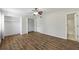 Bedroom features hardwood floor, ceiling fan, closet and bathroom with door open at 2825 Northeast Ne Expy # F003, Atlanta, GA 30345