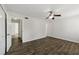 Bedroom with hardwood floors, ceiling fan, and open door at 2825 Northeast Ne Expy # F003, Atlanta, GA 30345