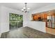 Dining room with hardwood floors, an adjacent kitchen, and sliding door to the deck at 2825 Northeast Ne Expy # F003, Atlanta, GA 30345