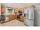 Beautiful kitchen boasts stainless steel appliances, granite countertops, and warm wood cabinetry at 2825 Northeast Ne Expy # F003, Atlanta, GA 30345