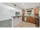 Open-concept kitchen and dining area with stainless steel appliances and breakfast bar at 2825 Northeast Ne Expy # F003, Atlanta, GA 30345