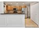 Well-lit kitchen with stainless steel appliances, light brown cabinets, and functional breakfast bar at 2825 Northeast Ne Expy # F003, Atlanta, GA 30345