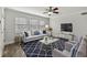 Living room with furniture, ceiling fan, hardwood floors, and a large area rug at 2825 Northeast Ne Expy # F003, Atlanta, GA 30345