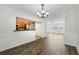 Open floor plan showcasing living room and dining area with new flooring and abundant natural light at 2825 Northeast Ne Expy # F003, Atlanta, GA 30345