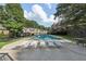 Community pool with lounge chairs for residents and guests at 2825 Northeast Ne Expy # F003, Atlanta, GA 30345