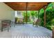 Back porch patio with a wooden bench at 545 Ashvale Overlook, Alpharetta, GA 30005