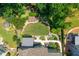 Aerial view of backyard features a beautiful landscaped yard, fire pit, walkway, deck, and gazebo at 545 Ashvale Overlook, Alpharetta, GA 30005