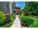 Landscaped backyard with stone pathway at 545 Ashvale Overlook, Alpharetta, GA 30005