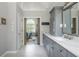 Bathroom with a view into the bedroom through sliding barn doors at 545 Ashvale Overlook, Alpharetta, GA 30005