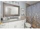 Bathroom with modern vanity, framed mirror, and bathtub at 545 Ashvale Overlook, Alpharetta, GA 30005