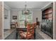 Dining room boasts a modern chandelier, a stylish rug, and a built-in hutch for ample storage and display at 545 Ashvale Overlook, Alpharetta, GA 30005