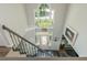 Grand foyer with chandelier and staircase leading to upper level and a view of the front door at 545 Ashvale Overlook, Alpharetta, GA 30005