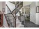 Elegant foyer with staircase, tile flooring, and sophisticated decor at 545 Ashvale Overlook, Alpharetta, GA 30005