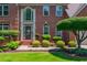 Well-maintained brick home with professionally landscaped front yard at 545 Ashvale Overlook, Alpharetta, GA 30005