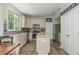 Bright kitchen with stainless steel appliances, granite countertops, and a center island at 545 Ashvale Overlook, Alpharetta, GA 30005