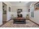 Bright living room with wainscoting, natural light, and stylish decor at 545 Ashvale Overlook, Alpharetta, GA 30005