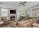 Inviting living room with fireplace, large windows, and comfortable seating for a relaxing atmosphere at 545 Ashvale Overlook, Alpharetta, GA 30005