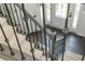 Carpeted staircase with metal railing at 545 Ashvale Overlook, Alpharetta, GA 30005