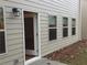 Home exterior features a door, five windows, vinyl siding and a charming outdoor lantern at 1392 Weatherbrook Cir, Lawrenceville, GA 30043