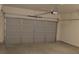 Garage featuring an automatic door opener and a neutral wall color at 1392 Weatherbrook Cir, Lawrenceville, GA 30043