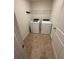 Well lit Laundry Room featuring washer and dryer at 1392 Weatherbrook Cir, Lawrenceville, GA 30043