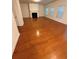 Spacious living room featuring a cozy fireplace and gleaming hardwood floors illuminated by natural light at 1392 Weatherbrook Cir, Lawrenceville, GA 30043