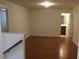 Hardwood floored Living Room featuring a view of the bathroom at 1392 Weatherbrook Cir, Lawrenceville, GA 30043