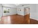 Spacious living room featuring hardwood floors, natural lighting, and neutral color scheme at 3665 Magnolia Walk Trl, Cumming, GA 30040