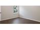 This bedroom features hardwood floors and a large window at 1496 Clarecastle Ln, Buford, GA 30519