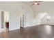 Large bedroom with hardwood flooring, two closets and a door to the bathroom at 1496 Clarecastle Ln, Buford, GA 30519