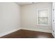 Bright bedroom with hardwood floors and natural light at 1496 Clarecastle Ln, Buford, GA 30519