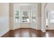 Light-filled dining nook with bay window and hardwood flooring at 1496 Clarecastle Ln, Buford, GA 30519