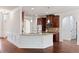 Open kitchen design featuring granite countertops, stainless steel appliances, and breakfast bar at 1496 Clarecastle Ln, Buford, GA 30519