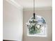 Large window with a view from the inside of a house and a chandelier at 1496 Clarecastle Ln, Buford, GA 30519
