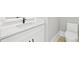 Modern half bathroom with a sleek vanity and updated fixtures at 3205 Bold Springs Rd, Dacula, GA 30019