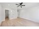 Spacious bedroom with hardwood floors and doorways leading to bathroom and walk-in closet at 3205 Bold Springs Rd, Dacula, GA 30019