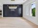 Elegant dining room featuring a modern chandelier, hardwood floors, and large windows offering ample natural light at 3205 Bold Springs Rd, Dacula, GA 30019