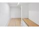 Bright hallway with hardwood floors and a built-in bench at 3205 Bold Springs Rd, Dacula, GA 30019