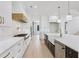 Modern kitchen featuring custom cabinets, marble countertops, and professional-grade stainless steel appliances at 3205 Bold Springs Rd, Dacula, GA 30019