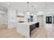 Gourmet kitchen featuring a large island, custom cabinets, marble countertops, and modern appliances at 3205 Bold Springs Rd, Dacula, GA 30019