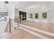 Bright, open living room features wood floors, fireplace, recessed lighting, and contemporary staircase at 3205 Bold Springs Rd, Dacula, GA 30019