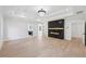 Large, open living room featuring recessed lighting, modern fireplace and beautiful flooring at 3205 Bold Springs Rd, Dacula, GA 30019